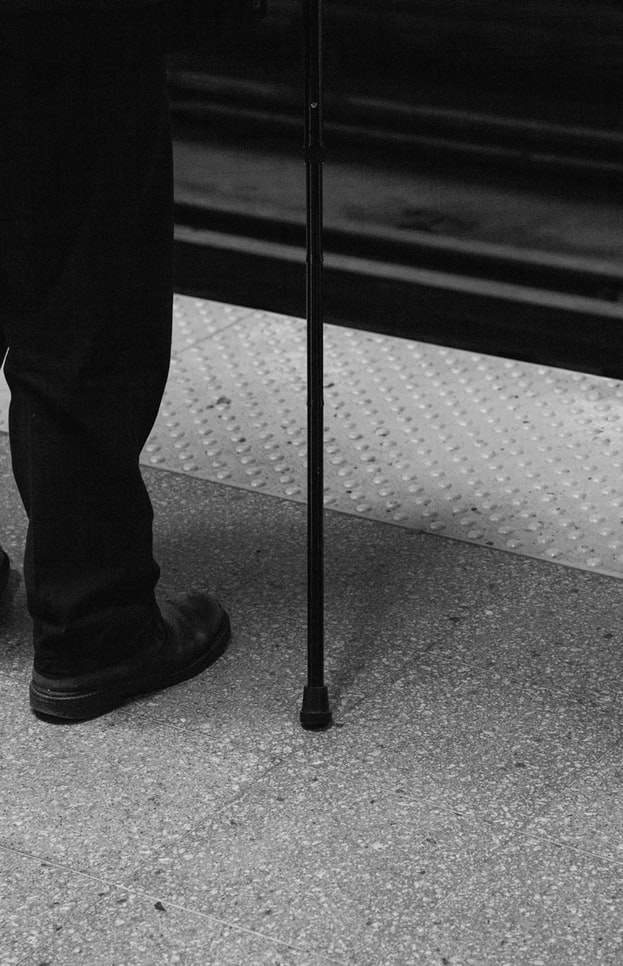 Blind person waiting subway