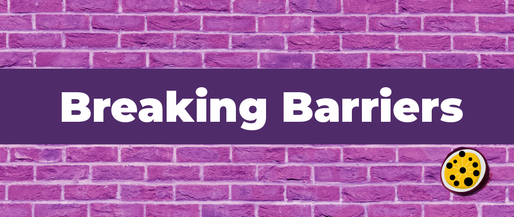 Purple brick wall with a heading saying breaking barriers and the passion for social pomegranate symbol in the bottom right of the image