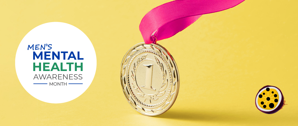 A gold medal with a pink ribbon placed against a yellow background, featuring text that reads 