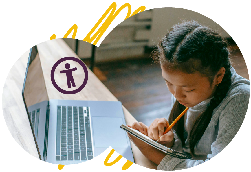 A young girl with braided hair is sitting at a wooden table, writing in a notebook with a pencil. She is focused on her work. A laptop is open beside her, and an accessibility icon is overlaid on the image.