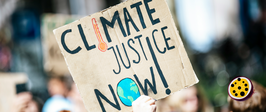 A protest sign being held up that reads 