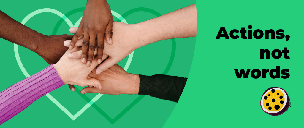 Diverse hands stacked together in a team gesture against a green background with white geometric shapes, accompanied by text reading 'Actions, Not Words'
