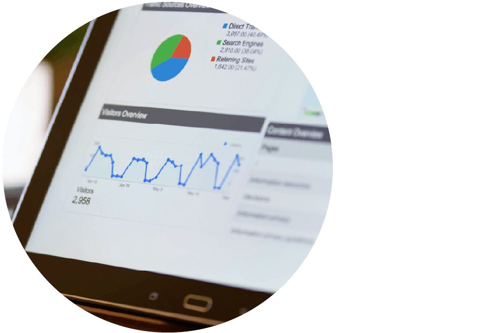 A tablet device with its screen displaying data with colourful charts and graphs.