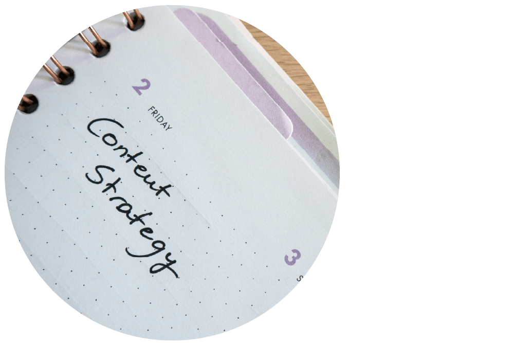 ‘Content’ and ‘Strategy’ handwritten in black ink on the page of an open diary.