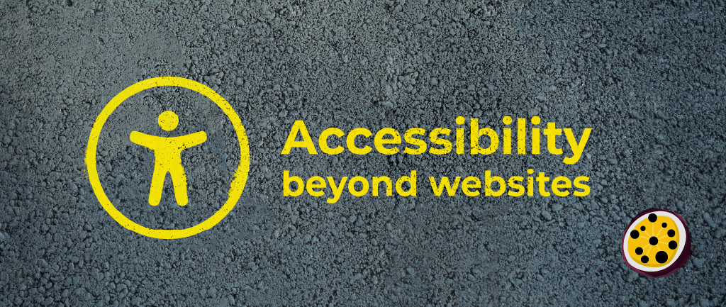 A dark grey, textured ground surface with a painted yellow accessibility icon. Painted yellow text reads: ‘Accessibility beyond websites.’ Passion4Social (logo).